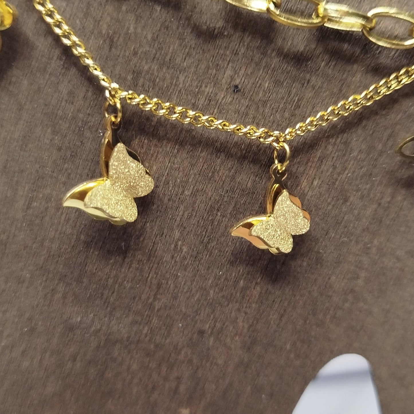 Gold chain bracelet with butterfly charms