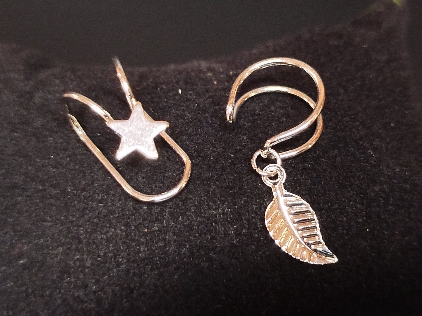 Silver earrings with star and leaf charms
