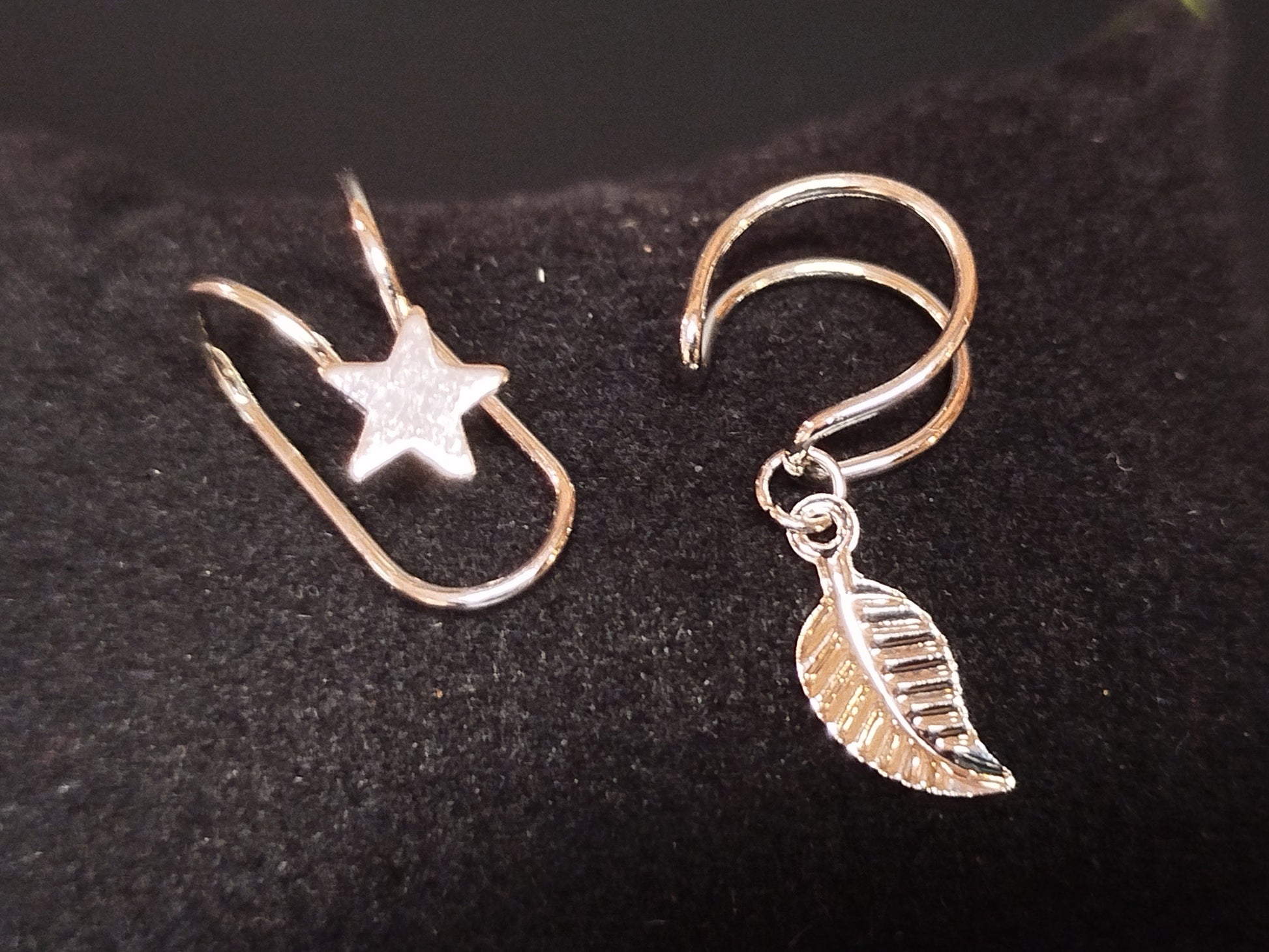 Silver earrings with star and leaf charms