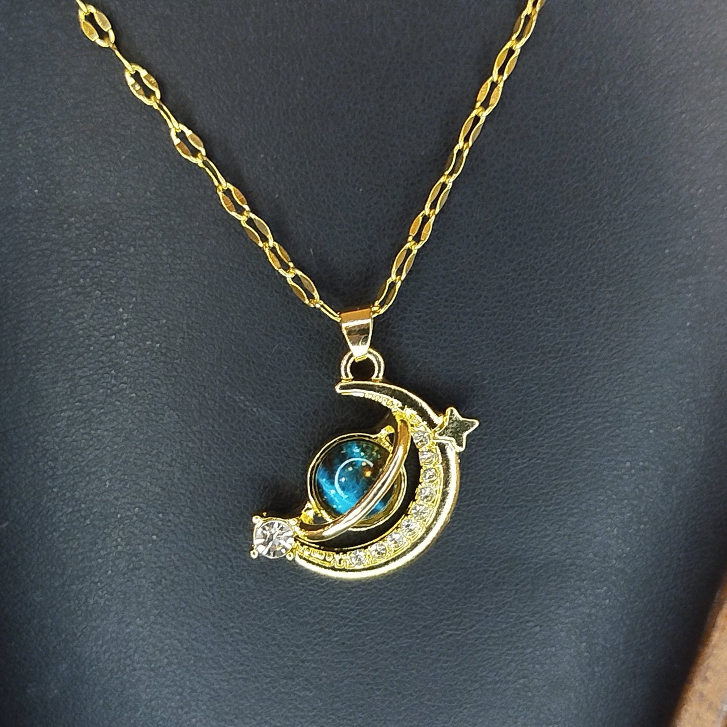 Gold necklace with a moon and star pendant