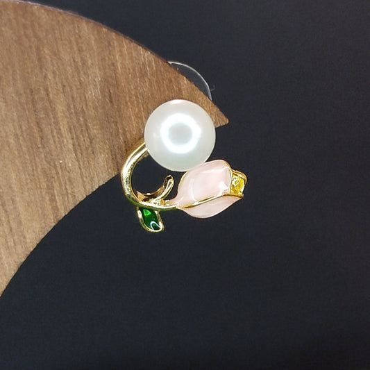 Pearl earring on a wooden stand