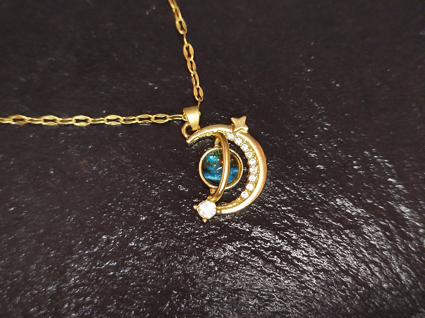Gold necklace with a moon and star pendant