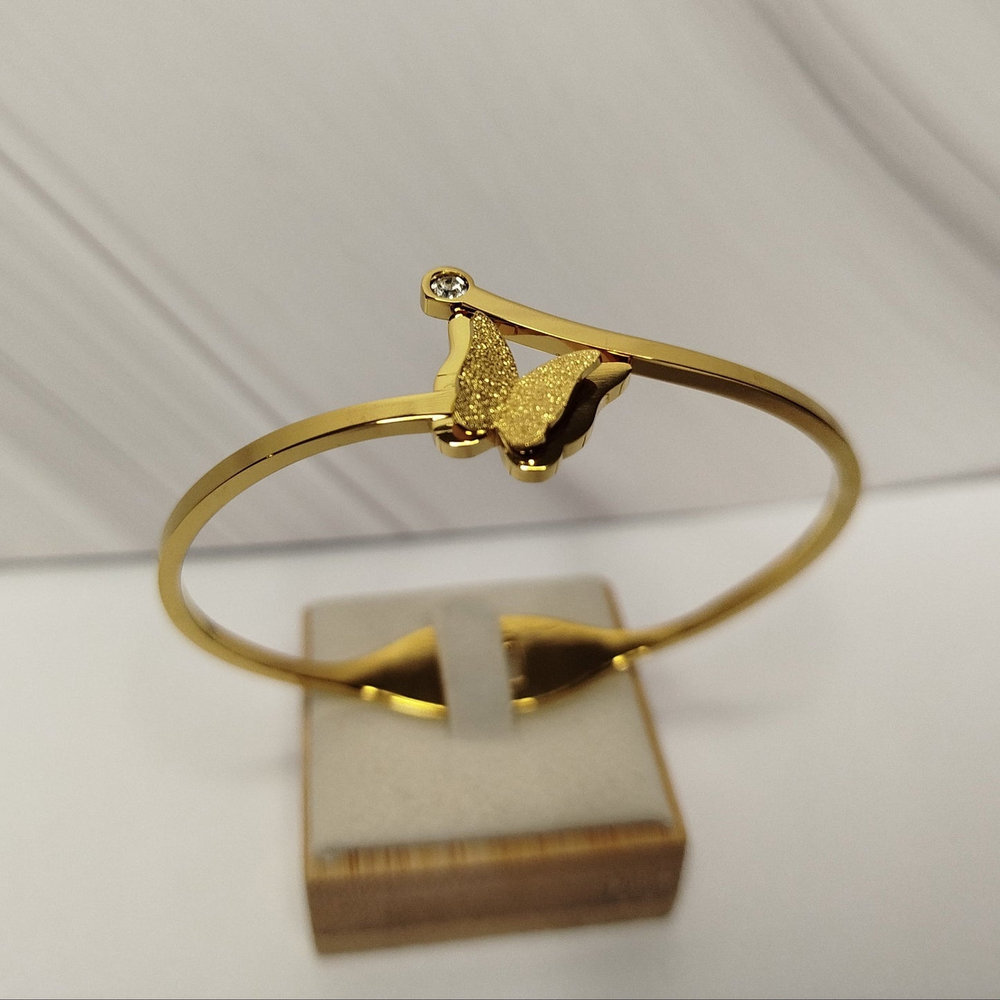 Gold bracelet with a butterfly design