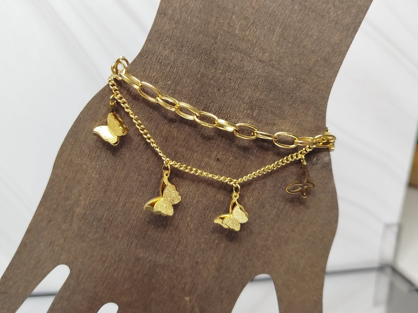 Gold bracelet with charms