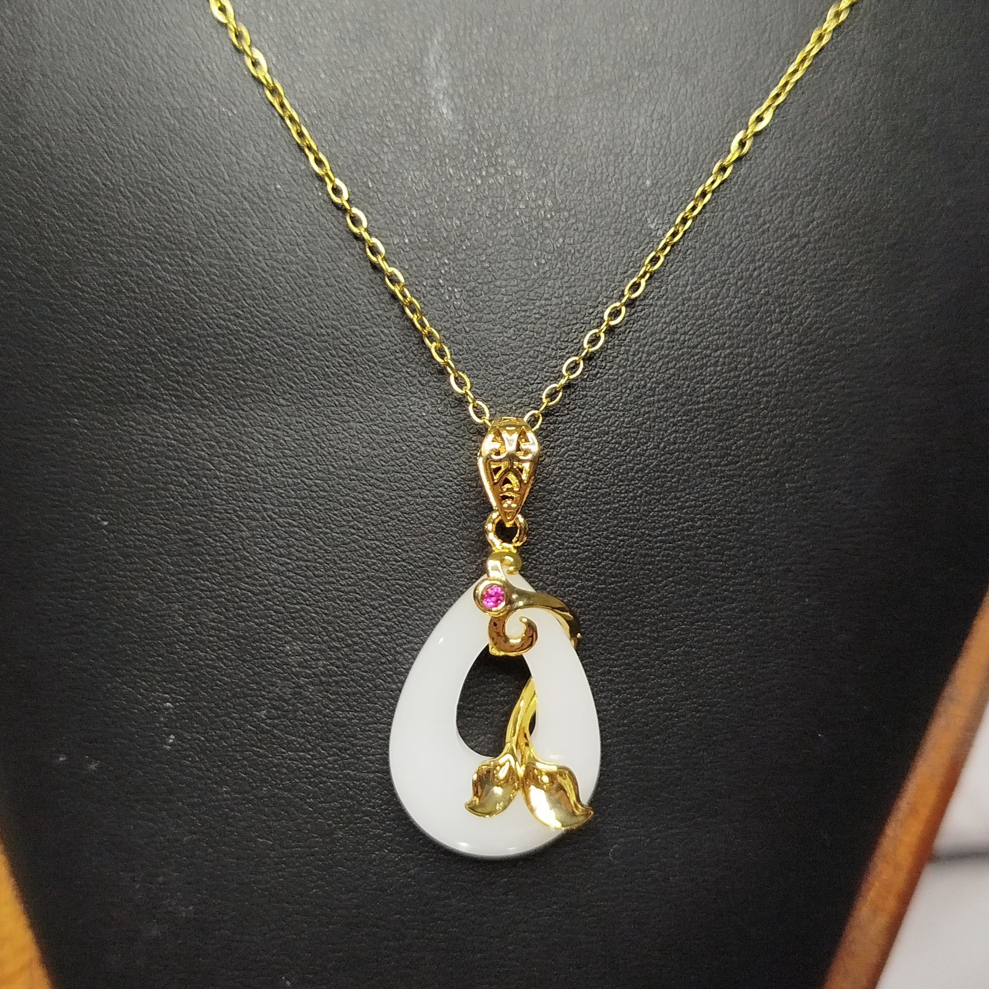 Gold and white pendant necklace
